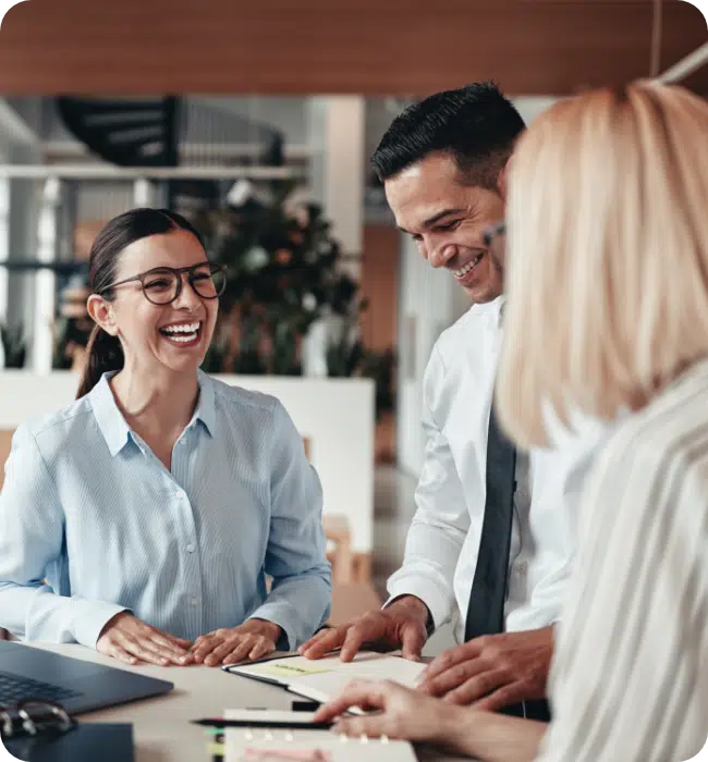 people smiling in a meeting