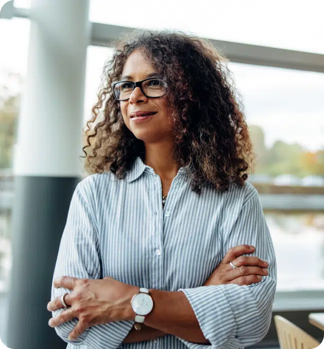 Focussed business woman folding arms