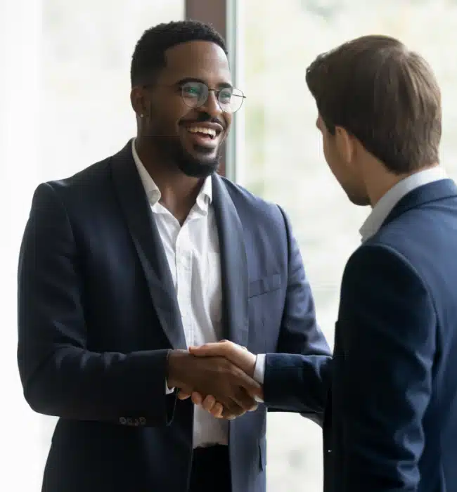 Two businessmen shaking hands.