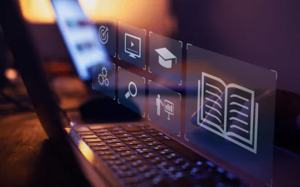 Laptop screen with holographic icons representing online education, video content, and search, symbolizing digital learning and student data collection.